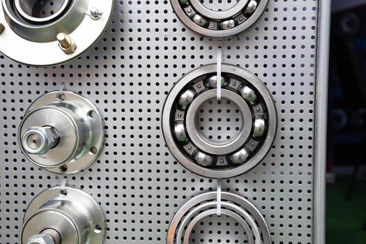 different bearings on a metal background. Part of mechanism. photo