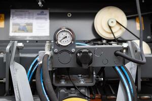 Hydraulic power unit mechanical valve with connection and pressure gauge. photo