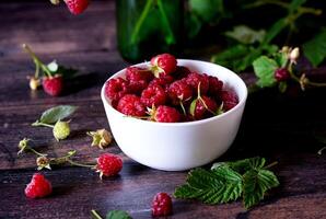 hot raspberry tea . Fresh berries, cubes of cane sugar and a bag of tea photo