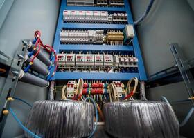 Voltage switchboard with circuit breakers. Electrical background. photo