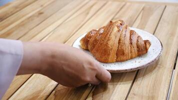 Freshly baked croissant on wooden table at local bakery video