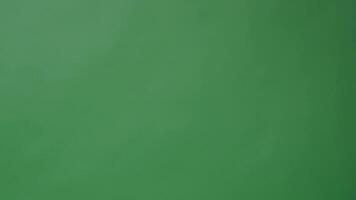Clapper board clapped by Hands on green screen camera background. Filmmaker hit film slate on green camera frame. Clapperboard Chroma key suit shooting. Green screen composite film production. video