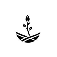 A minimalist botanical featuring a budding flower and leaves, encapsulated within a circle representing growth and nature. vector