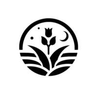 Monochromatic floral emblem within a circle depicting a stylized tulip, grass, crescent moon, and stars against a bright white background. vector