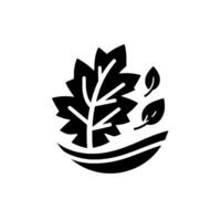 A minimalist, blackandwhite featuring an oak leaf with intricate veins and a stylized representation of grass and falling leaves. vector