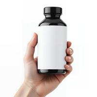 Elegant black bottle with blank label held in hand against a transparent background photo