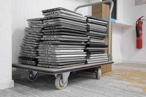 E-waste - stack of laptops to be discarded photo