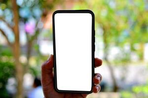 mockup of hand holding smartphone with black screen isolated on bokeh background, mockup of mobile phone hand photo