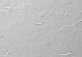 A white paper with a few small holes photo