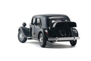 ALMATY, KAZAKHSTAN - FEBRUARY 23, 2014 Black vintage retro car with an open trunk isolated on white background photo
