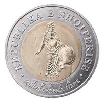 A coin with a statue of a woman holding a sword photo