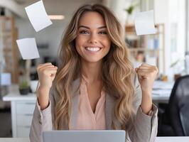 Business woman in a business suit in the office with a laptop on the front of documents in the air. The atmosphere of happiness, success and liberation from work in a modern office photo