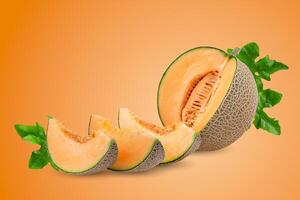 whole and slice of japanese melons, orange melon or cantaloupe melon with seeds isolated on an orange background photo