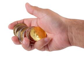 man hand holding golden Bitcoin isolated on a white background photo