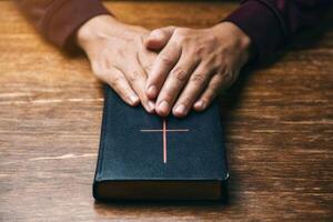 Christian Cross Background with a Beautiful Cross and Jesus Cross Featuring a Red Cross with a Bible and Hand photo