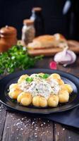 Satisfying plate of ravioli accompanied by a side of fresh bread for a complete and delicious italian meal experience photo