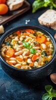 A warm bowl of hearty soup filled with nutritious beans and fresh carrots, ideal for a comforting meal or snack photo