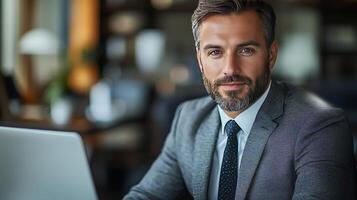 Confident mature caucasian male professional with beard in office setting photo
