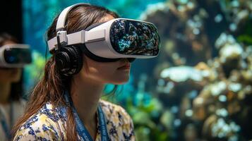 Asian female using virtual reality headset in aquarium setting photo