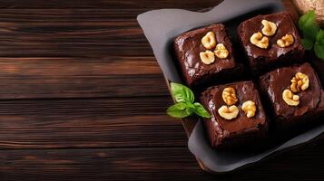 Plate of decadent brownies topped with crunchy nuts for a deliciously rich and satisfying sweet treat experience photo