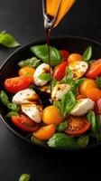 Vibrant bowl of fresh salad featuring ripe tomatoes and creamy mozzarella cheese for a nutritious and flavorful meal photo