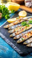 A delectable plate of grilled fish presented on a table surrounded by fresh ingredients for a healthy dining experience photo