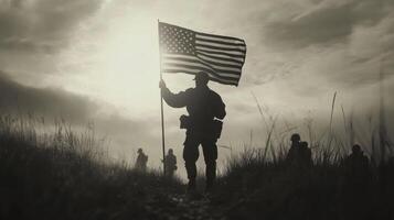 Memorial day Soldiers march with United states flag. Monochrome view of army men walking on field holding united states flag against cloudy sky. Patriotic scene. Military parade. photo