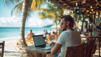 Freelancer Man works on laptop. Beach view. Outdoor cafe. Palm trees. Summer travel. Remote work. Digital nomad lifestyle. Vacation time. Tropical paradise. Coastal scene. photo