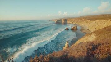 Ocean view. Sea water wave. Cliffs overlooking the ocean. Calm landscape with horizon and blue sky. Rocky shore by sea. Coastal scenery nature. photo