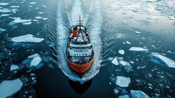 Large ship sailing through cold sea. Many icebergs float around. Ocean water is dark blue. Travel on water. Ship moves forward fast. photo