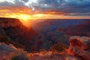 Grand Canyon landscape. Sunset over layered rock. View from high cliff. Golden light on horizon. Travel destination. Nature scenery. photo