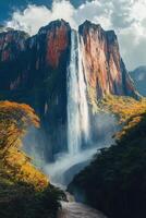 Waterfall flows from high mountain. Water plunges to river below. Trees grow near rocky cliffs. Sky visible above. Beautiful nature scenic. photo