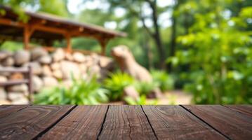 Wooden table top over blurred garden background photo