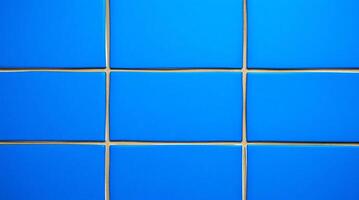 A blue wall with a square pattern photo