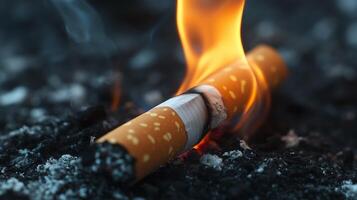 A cigarette burning on the ground photo
