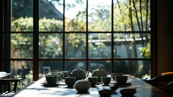 A table with a lot of cups and bowls on it photo