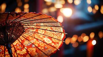 An oriental umbrella is shown in front of a building photo