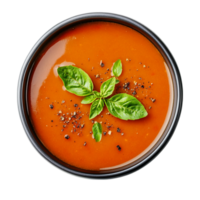 Delicious tomato soup with basil in a bowl top view isolated on transparent background png