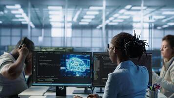 Admin in data center using artificial intelligence computing simulating human brain thought processes in computerized model. Employee working with AI machine learning algorithms, camera A photo