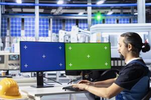 Solar panels plant engineer overseeing energy consumption on green screen PC display. Photovoltaics facility employee ensuring optimal use of manufacturing resources using chroma key computer photo