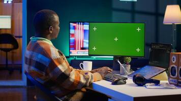 On terminal window, server technician optimizing program and next to green screen, integrating HTML tags with IT technical language. Database handled by self employed software expert. Camera A. photo