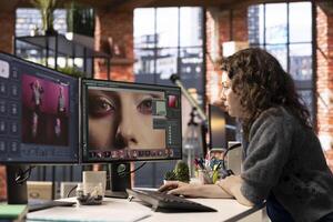 Woman using AI software to turn text prompt into photos and editing the skin, working with retouching interface program for media content. Uses text to image generative models on PC.