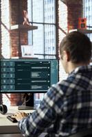 Language model chatbot on computer monitor engages in humanlike interactions with customers. Person speaks with artificial intelligence LLM software handling his requests photo