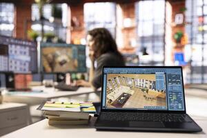 Woman uses architectural software on her PC to create a detailed 3D render of a home interior. The program allows to drag and configure furniture and other design elements for a virtual layout. photo