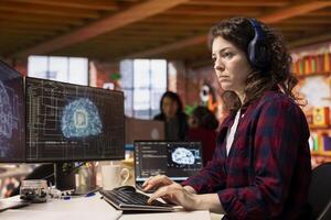 IT engineer wearing headphones works in AI tech agency providing custom software development services. IT expert listening music, using artificial intelligence technology to streamline coding process photo