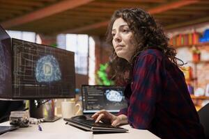 System administrator in startup office coding advanced AI algorithm and machine learning models enhancing automation. IT specialist using PC in artificial intelligence Silicon Valley workplace photo