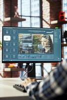 Graphic editor designing user interface for AI software turning text prompt into photos. Close up of man in home office designing text to image models using machine learning tech photo
