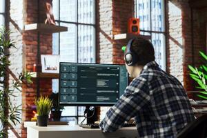 Man listening music uses conversational AI bot used to provide help for company customers. Person wearing headphones getting job done with LLM powered chatbot helping him photo