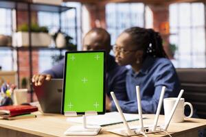 Black man and woman having problems with home internet next to mockup screen, identifying weak connection and testing different troubleshooting techniques to fix their network errors. photo
