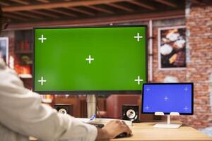 Teleworker inputting data on isolated screen PC and tablet, completing spreadsheets in home office. Remote worker editing documents on mockup devices, updating reports and files, close up photo